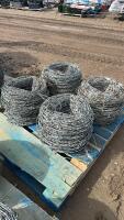 Pallet of four rolls of used barbed wire