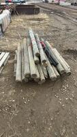 Small bundle of posts and barbwire gate