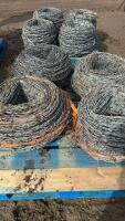 Pallet of four rolls used Barb wire