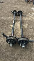 Pair of 7000 pound straight axles with spring springs