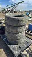 Stack of four wrangler Tires