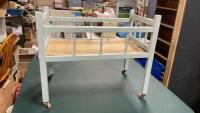 DOLL CRIB ON WOOD CASTORS