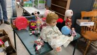 (2) VINTAGE DOLLS, SMALL GLOBE COIN BANK, MINNIE MOUSE STUFFIE, SANTA STUFFIE, BOB SKATES, TOOL CADDY W/ TIN DISHES