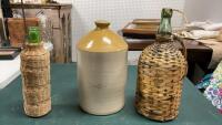 POTTERY JUG & (2) BOTTLES W/ WICKER