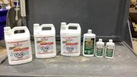 BOX W/(3) JUGS OF THOMPSON&rsquo;S WATER SEAL + (3)BOTTLES OF OIL GRABBER