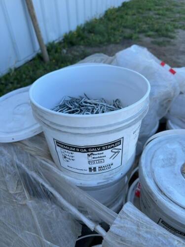 Six pails of new one and three-quarter inch barbed staples / bid per pail
