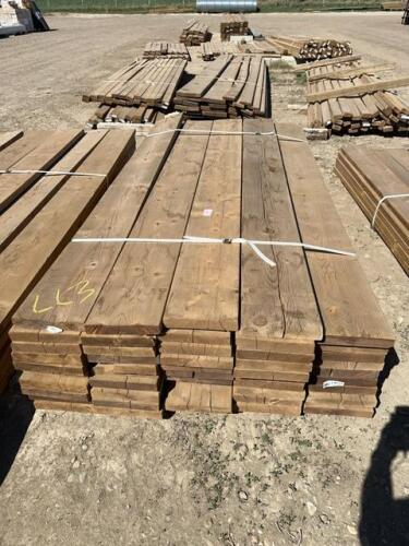 Bundle of 2 x 10 treated by 8 feet