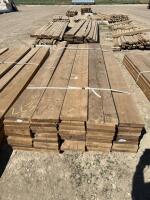 Bundle of 2 x 10 treated by 8 feet