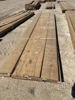Bundle of treated 2 x 12 x 16 plank