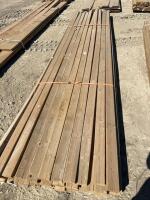 Bundle of 14 foot 2 x 4 treated