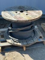 Partial spool of four wire electric electrical cable