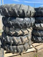 Stack of five pivot tires on steel rims