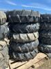Stack of five pivot tires on steel rims