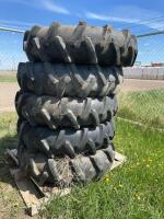 Stack of five pivot tires mounted on steel rims