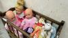 ROLLING DOLL CRIB W/ (3) DOLLS - 3