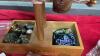 BOX W/ COSTUME JEWELRY, DISPLAY RACKS, MONEY JAR - 6