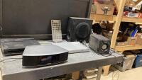 ASSORTMENT OF ELECTRONIC DEVICES - PHILIPS DVD PLAYER, SONY DVD PLAYER, INNOVAGE REMOTE, SYLVANIA SPEAKER, BOSE SPEAKER