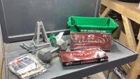 GREEN BIN W/GOLF BALLS (NEW), 25 POUND WEIGHT, TENT PEGS, TRAILER LEVELING JACKS
