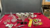 BOX W/MISC VINTAGE ITEMS - COFFEE MUGS, COVERED CANDY DISH, OLD WELDING GLASSES, SYRINGE, CAN OPENER, ETC