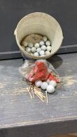 PAIL WITH WHITE GOLFBALLS AND WOODEN TEES