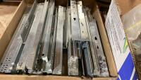 (3)BOXES OF CABINET HARDWARE - HINGES, SLIDES, DRAWER SLIDE LOCKING PIECES