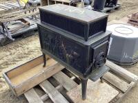 CAST IRON STOVE W / WESTERN SCENES ON THE SIDES