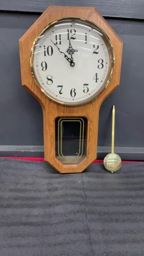 FORESTVILLE BATTERY OPERATED WALL CLOCK W/ A PENDULUM