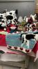 COLLECTION OF COW DECOR - PILLOWS, STUFFIES, ORNAMENTS, MUG AND COASTERS, A RUG, AND A PAPER TOWEL HOLDER - 2