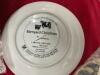 BOX W/ COLLECTOR PLATES AND (2) PLATE RACKS - 11 COW COLLECTOR PLATES AND 1 NORMAN ROCKWELL - 7