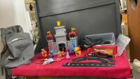 RUBBER RACE CAR BUILDING TRACK, PAW PATROL CASTLE W/ DRAGONS AND CHARACTERS, AND A LIGHTNING MCQUEEN UNFOLDING TOY SEMI IN A CANVAS BAG
