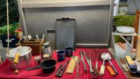 BOX OF CAMPFIRE/CAMPING ITEMS - SNEIDERS POPCORN POPPER, ENAMEL MUGS, BBQ TOOLS, HAMBURGER COOKER, CUTLERY BASKET W/ CUTLERY, COLEMAN GRIDDLE
