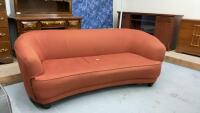 RETRO BURNT ORANGE SOFA W/ SLIGHT CURVE IN THE FRONT