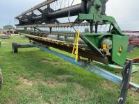 John Deere 220 straight cut header on transport