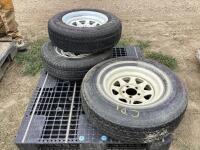 (2) TRAILER TIRES W/ 5-BOLT RIMS & (1) STEEL RADIAL TIRE W/ 5-BOLT RIMS