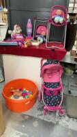 ROUND ORANGE BIN W/ TOYS & A DOLL STROLLER