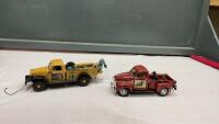 (2) ERTL COLLECTIBLES TRUCKS - 1947 STUDEBAKER W/ 2 PUPPIES + DODGE POWERWAGON W/ CANOE AND DOGS AND SPARE TIRE