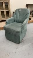 BLUE CUSHIONED SWIVEL CHAIR