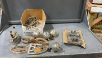 ANTIQUE GAS & SAD IRON PARTS AND A BOX TIE-DOWN