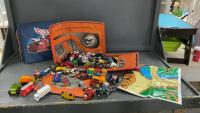 VARIETY OF HOT WHEEL CARS & TRUCKS IN A HOT WHEELS BAG