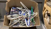 BOX OF ASSORTED PLASTIC HANGERS