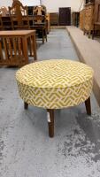 ROUND OTTOMAN W/ MUSTARD COLOR FABRIC COVERING