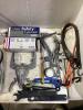SHOP BOX OF MISCELLANECOUS W/ SAFETY GLASSES, BATTERY TESTER, OIL WRENCH, ANGLE GRINDER GUARDS & METAL WIRE - 5