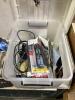 TOTE OF MISCELLANEOUS ELETRONICS W/ CABLES, CASSETTES, REMOTE, BRUSHED & AC ADAPTER - 2
