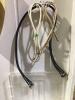 TOTE OF MISCELLANEOUS ELETRONICS W/ CABLES, CASSETTES, REMOTE, BRUSHED & AC ADAPTER - 3