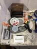 TOTE OF MISCELLANEOUS ELETRONICS W/ CABLES, CASSETTES, REMOTE, BRUSHED & AC ADAPTER - 7