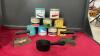 TOBACCO TINS, (2) ELECTRIC IRONS, SMALL CAST POT W/ SPOUT