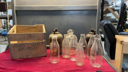 VINAGE BOTTLES AND A WOOD JERSEY DAIRY CRATE