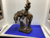 AUSTIN SCULPURE RIDER AND HORSE. CHIPS