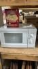SMALL MAGNOSONIC WHITE MICROWAVE W/ A BOX OF POPCORN
