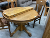 OAK TABLE W/TWO LEAVES + THREE CHAIRS. 42” ROUND. LEAVES ARE 10”EA - 2